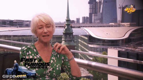 Woman Sitting On Balcony Wearing Green Shirt GIF