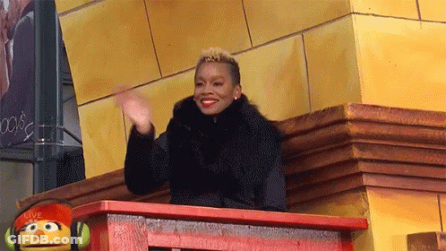 Woman Sitting On Balcony With Sesame Street Puppet GIF