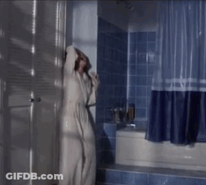 Woman Sitting On Bathroom Floor Screaming GIF