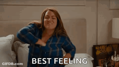 Woman Sitting On Bed Hands On Chest Saying Best Feeling GIF