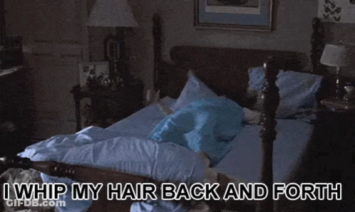 Woman Sitting On Bed I Whip My Hair Back And Forth GIF
