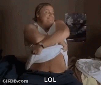 Woman Sitting On Bed Making Funny Face GIF