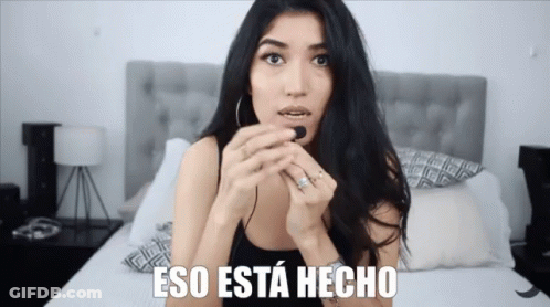 Woman Sitting On Bed Saying Eso Esta Hecho GIF
