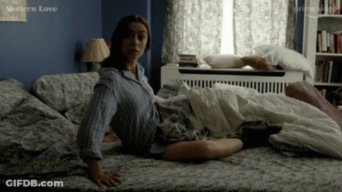 Woman Sitting On Bed With Modern Love GIF