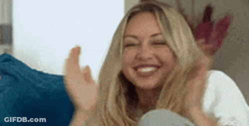 Woman Sitting On Couch Clapping GIF