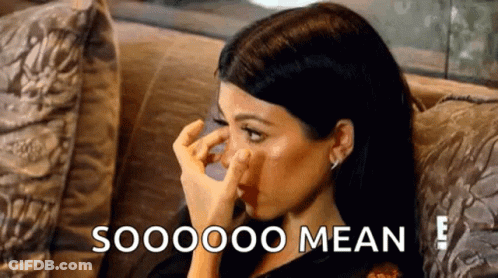 Woman Sitting On Couch Covering Nose GIF
