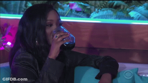 Woman Sitting On Couch Drinking Water GIF