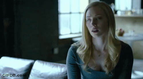 Woman Sitting On Couch Eyes Closed GIF