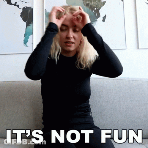 Woman Sitting On Couch Hands On Head Saying It's Not Fun GIF