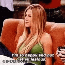 Woman Sitting On Couch Holding Coffee And Phone GIF