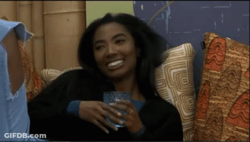 Woman Sitting On Couch Holding Glass Of Water GIF