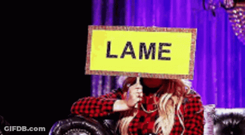 Woman Sitting On Couch Holding Lame Sign GIF