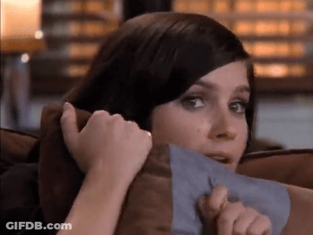 Woman Sitting On Couch Holding Paper GIF