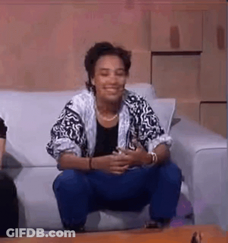 Woman Sitting On Couch Legs Crossed GIF