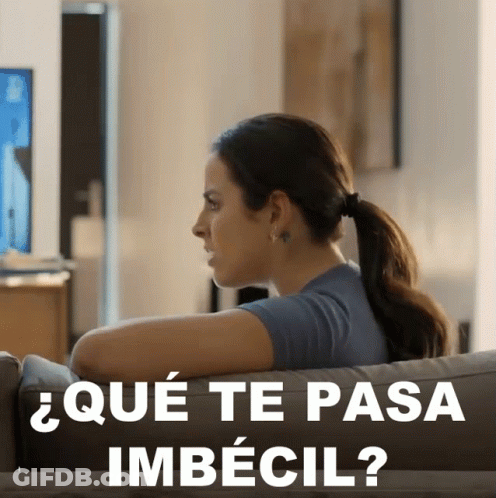 Woman Sitting On Couch Que Te Pasa Imbecil GIF