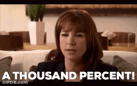 Woman Sitting On Couch Saying A Thousand Percent GIF