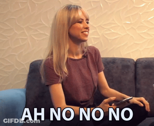 Woman Sitting On Couch Saying Ah No No No GIF