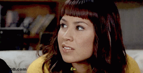 Woman Sitting On Couch Saying Ew GIF