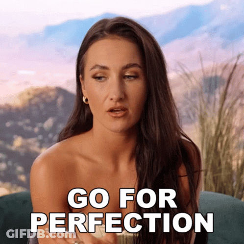 Woman Sitting On Couch Saying Go For Perfection GIF