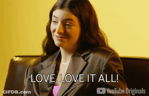 Woman Sitting On Couch Saying Love Love It All GIF