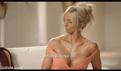 Woman Sitting On Couch Saying Miranda Not Me GIF