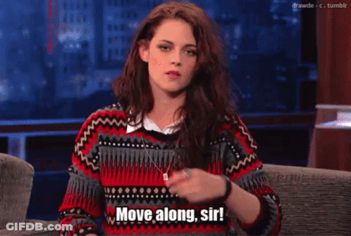 Woman Sitting On Couch Saying Move Along Sir GIF