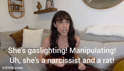 Woman Sitting On Couch Saying She's Gaslighting GIF