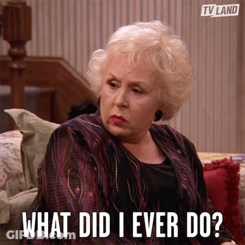 Woman Sitting On Couch Saying What Did I Ever Do GIF