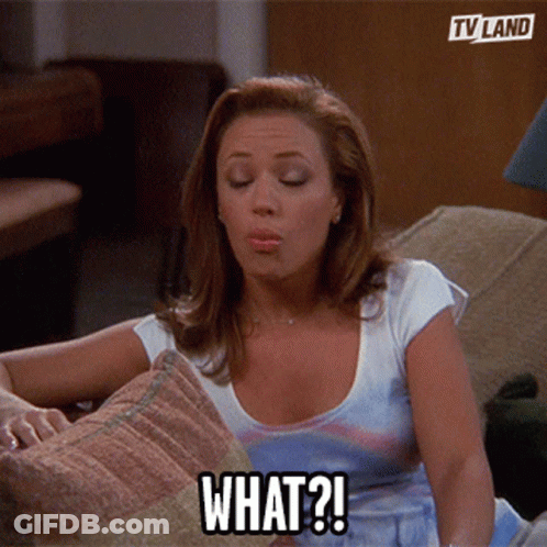 Woman Sitting On Couch Saying What GIF
