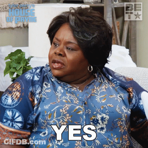 Woman Sitting On Couch Saying Yes GIF