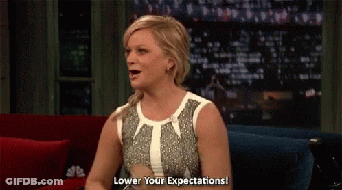 Woman Sitting On Couch Says Lower Your Expectations GIF