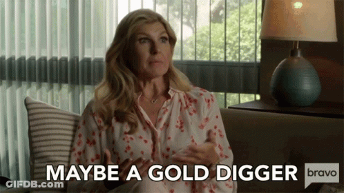 Woman Sitting On Couch Says Maybe A Gold Digger Bravo GIF