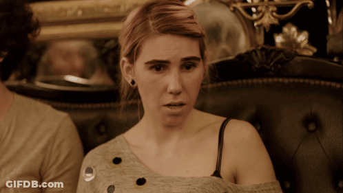 Woman Sitting On Couch Surprised GIF