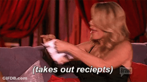 Woman Sitting On Couch Takes Out Receipts GIF