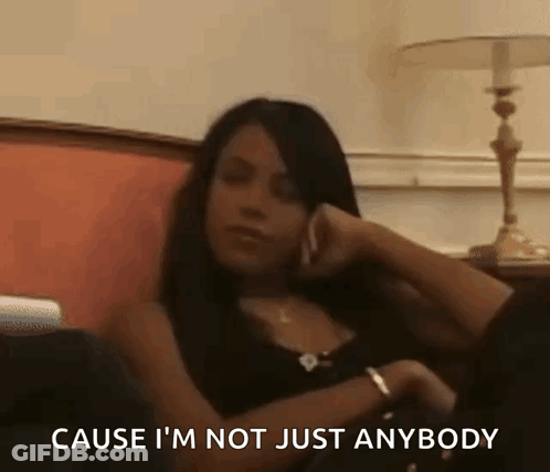 Woman Sitting On Couch Talking On Cell Phone GIF