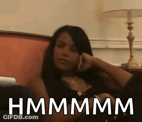 Woman Sitting On Couch Talking On Cell Phone Hmmmm GIF