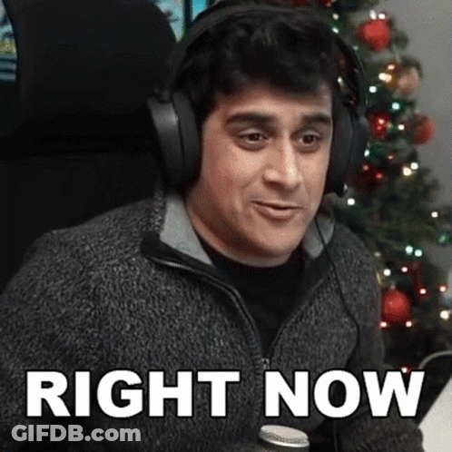 Woman Sitting On Couch Under Netflix Blanket GIF