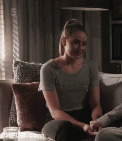 Woman Sitting On Couch Wearing Dallas Shirt GIF