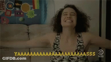 Woman Sitting On Couch With Arms Outstretched GIF