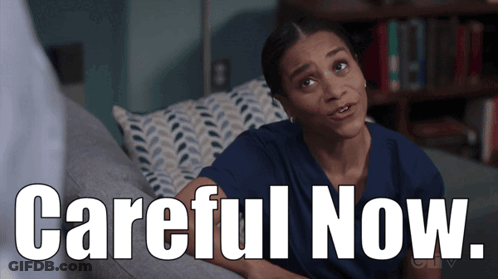 Woman Sitting On Couch With Careful Now GIF