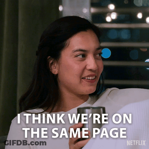Woman Sitting On Couch With Cup And Same Page GIF