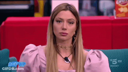 Woman Sitting On Couch With #Gfvip On Bottom Left GIF
