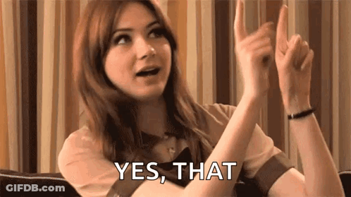 Woman Sitting On Couch With Hands Up GIF