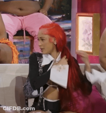 Woman Sitting On Couch With Mouth Open GIF