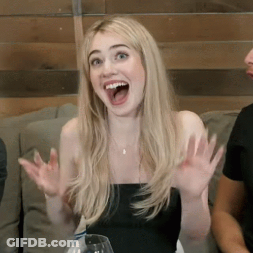 Woman Sitting On Couch With Mouth Open GIF