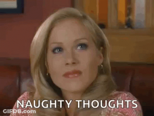 Woman Sitting On Couch With Naughty Thoughts GIF