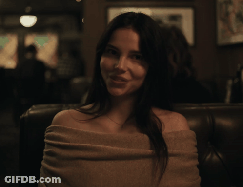 Woman Sitting On Couch With No On Chest GIF