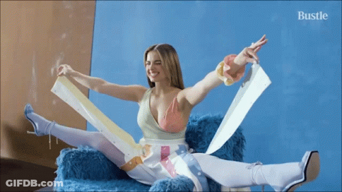 Woman Sitting On Couch With Outstretched Arms GIF