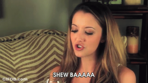 Woman Sitting On Couch With Shew Baaaa GIF