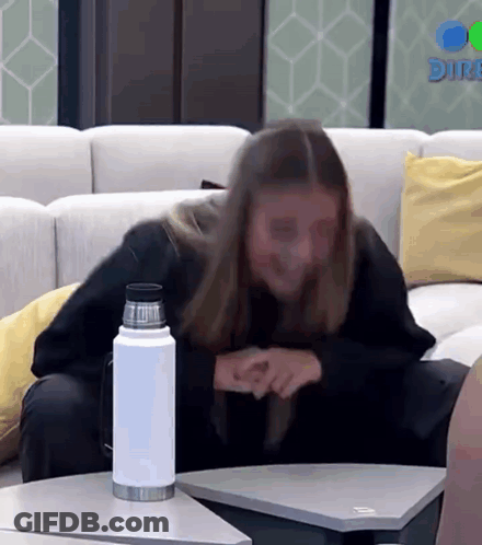 Woman Sitting On Couch With Water Bottle GIF